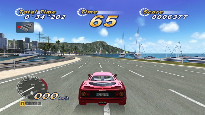 Egy piros autó száguld egy festői tengerparton az OutRun 2006: Coast 2 Coast játékban