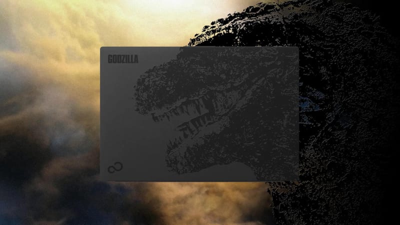 Fujitsu Godzilla laptop fedele fekete Godzilla illusztrációval és hátúszó alakú érintőpaddal