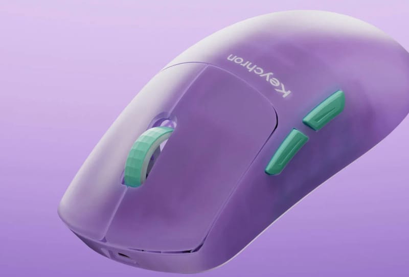 Keychron G6 HE wireless gaming mouse shown in a translucent colourway on a desk