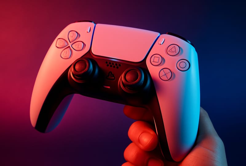 PS5 home screen mockup showing a dedicated PS5 Crunchyroll hub icon among other app shortcuts