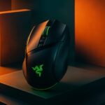 Razer Basilisk V4 Pro gaming mouse shown beside its Mouse Dock V2 Pro charging dock